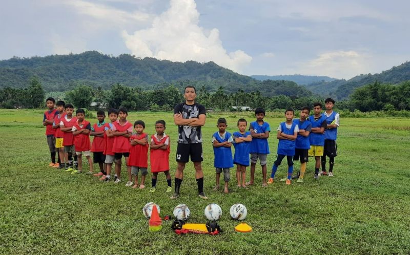 Lironthung Lotha and the boys pose for a photo after a practice session. He informs the boys are taught basic hygiene and safety protocol recommended by the government.